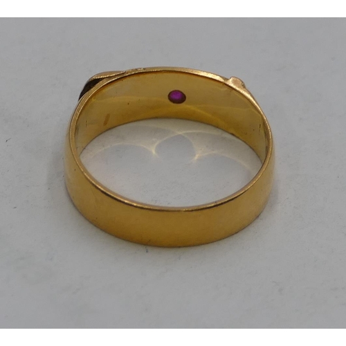 612 - A high carat gold buckle ring set with small ruby, size I/J, 3.8g