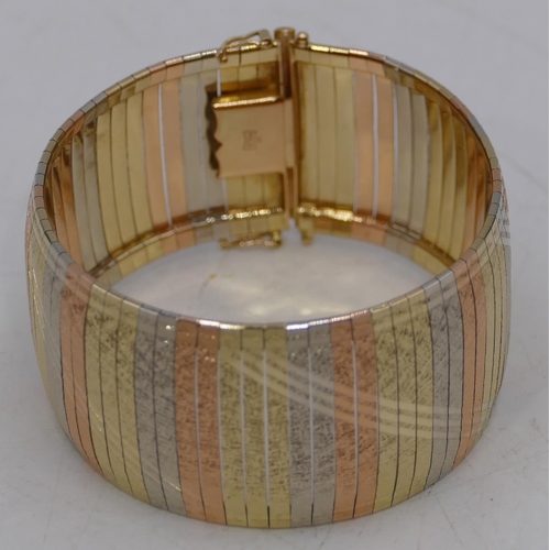 625 - A 14ct 3 colour gold wide band bracelet, allover etched decoration, 19.2cm long, 43.1g