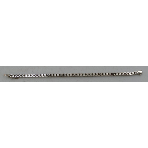 626 - An 18ct white gold ladies diamond tennis bracelet, mounted with 41 diamonds (each approx. 0.20ct), a... 