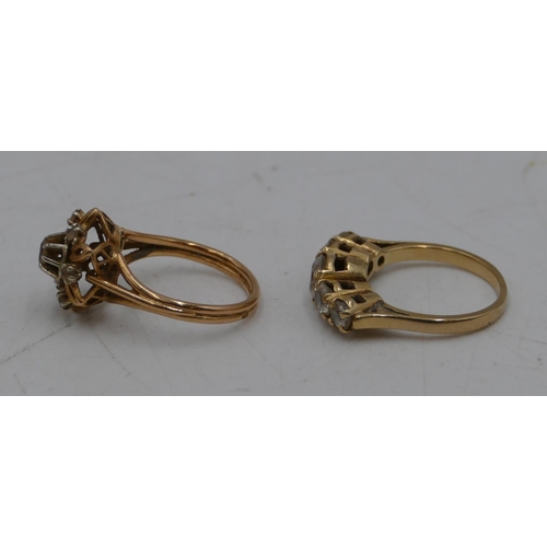 638 - A Continental gold cluster ring set with clear stones, size K/L and a ladies ring set with 5 graduat... 