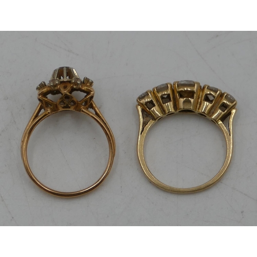 638 - A Continental gold cluster ring set with clear stones, size K/L and a ladies ring set with 5 graduat... 