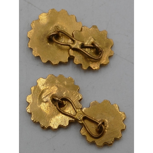 649 - A pair of Continental high carat gold round scallop shaped cufflinks with raised studded decoration,... 