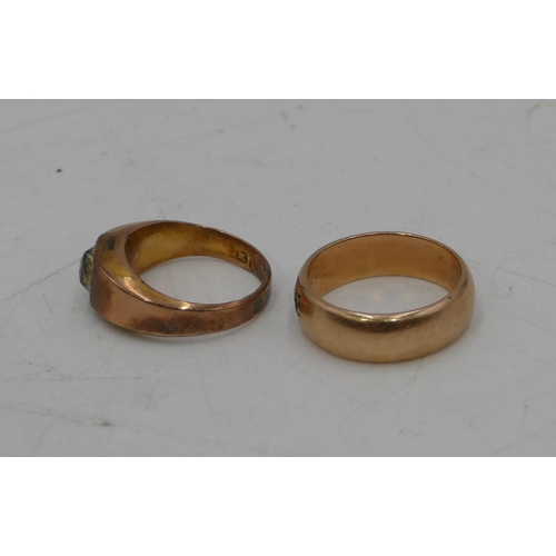 674 - A gold wedding ring inset with single clear stone, size R, a 9ct gold ring set with single glass sto... 