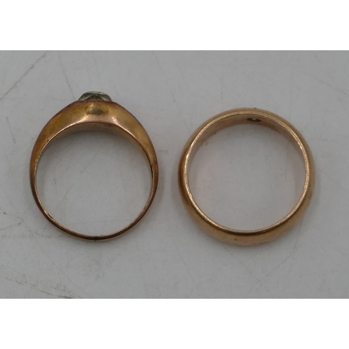 674 - A gold wedding ring inset with single clear stone, size R, a 9ct gold ring set with single glass sto... 