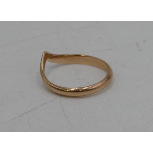 675 - A gold wishbone shaped ring, size T/U, 2.8 grams.