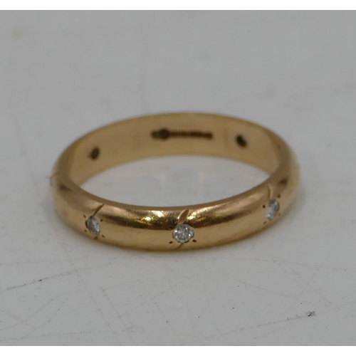 676 - A 9ct gold full eternity ring set with 8 small diamonds, size P/Q, 3.1 grams gross.