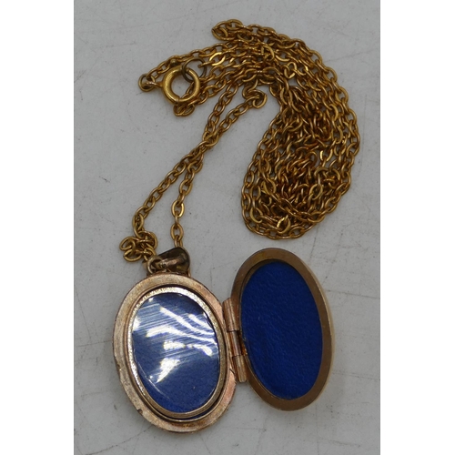 677 - A 9ct gold oval locket with chased decoration, with 9ct gold chain, 7.8 grams gross.