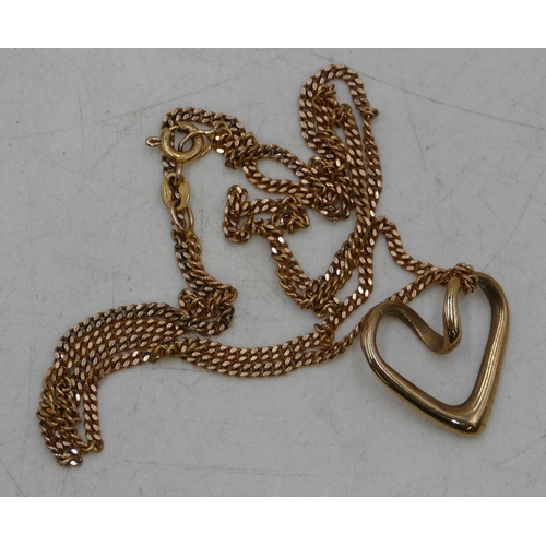 680 - A gold heart shaped pendant with gold chain, 6.5 grams.