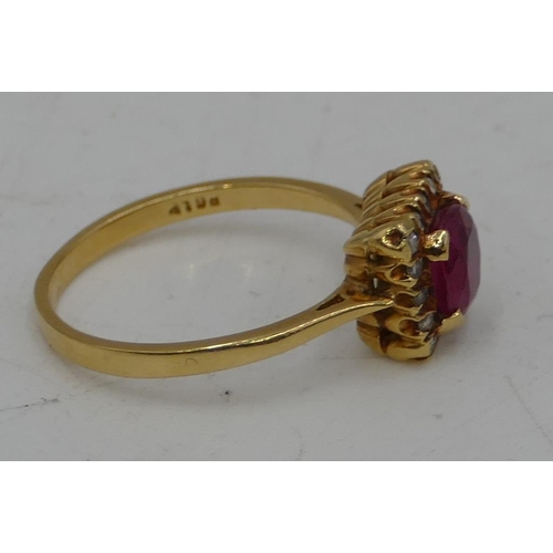 683 - An 18ct gold square set ladies ring set with centre ruby and surrounded by 16 small diamonds, size P... 