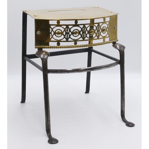 690 - A 19th Century brass and wrought iron bow fronted trivet with splayed legs. 31cm wide, 34.5cm high, ... 