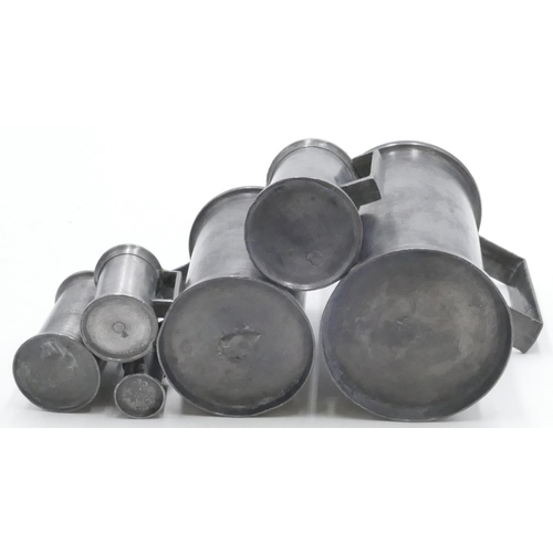 693 - 6 various Continental pewter measures 2 x 1 litre measures, 2 medium, 15cm high and 2 smaller measur... 