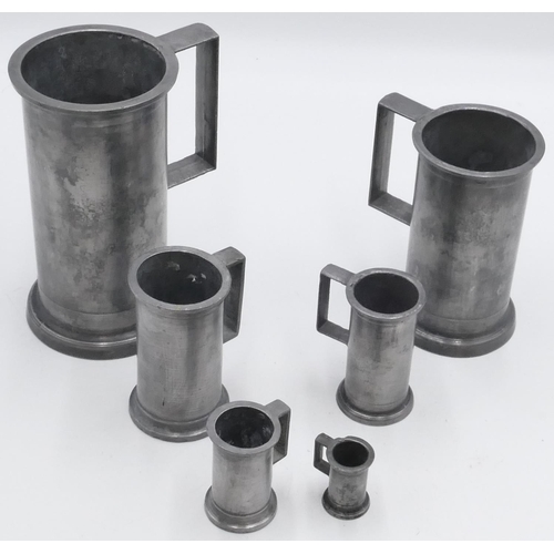 694 - 6 graduated Continental pewter measures, 1 litre, 19cm high and graduating to 4.2cm high. (6)