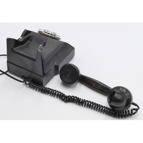 698 - A vintage Bakelite ATM black telephone with chrome dial wheel.