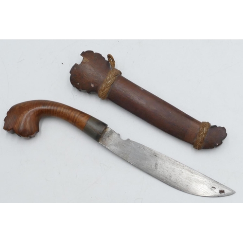 711 - An Eastern dagger with carved wooden handle and sheath, 28.5cm long overall.