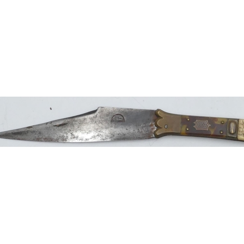 712 - An Eastern brass handled folding knife with tortoiseshell and bone inserts, 31cm long open, 17cm lon... 