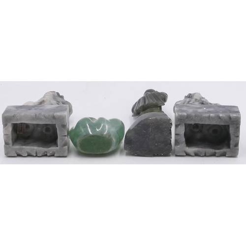 718 - A green hard stone figure of a seal lying on its back, 7.5cm wide, a pair of hard stone figures, dog... 