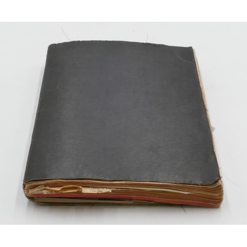 721 - An early 20th Century photographic and notebook album (inscribed to interior 