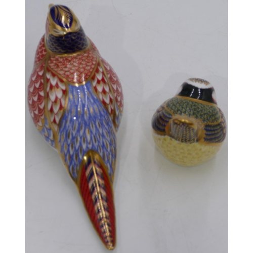 73 - 2 Royal Crown Derby paperweights in form of birds with gold coloured stoppers, largest 17.5cm long. ... 