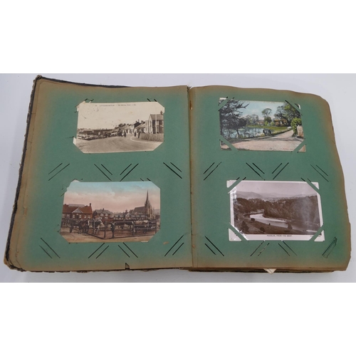 743 - A postcard album containing Surrey views etc.