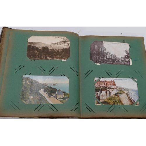 743 - A postcard album containing Surrey views etc.