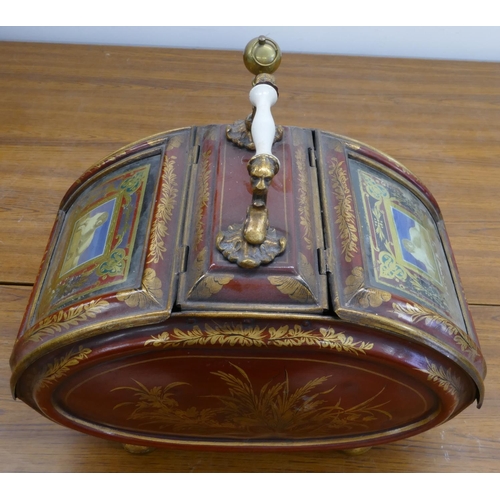 744 - A Victorian Toleware coal bucket on red ground with double hinged ends, with dog motifs and allover ... 