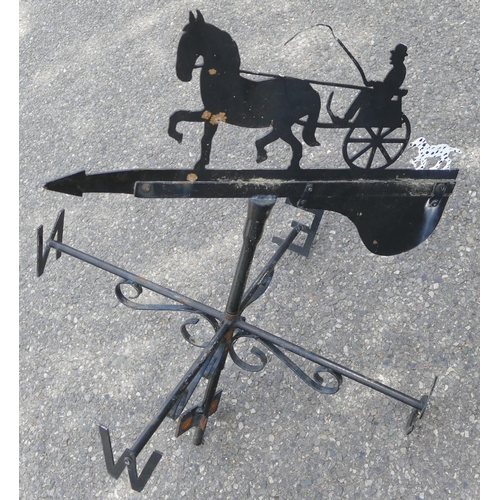 745 - A cast iron weather vane depicting figures in horse drawn carriage with dog motif, 80cm high overall... 