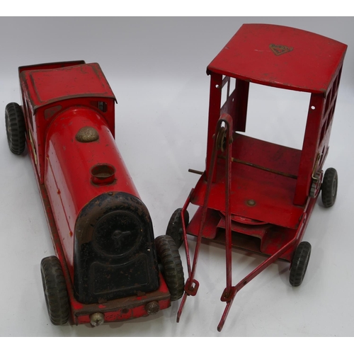 746 - Tri-ang tin plated locomotive on red ground, 53cm long and a Tri-ang tin plated crane (parts missing... 