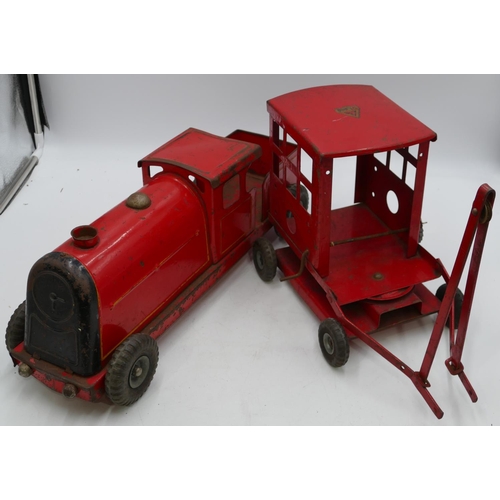 746 - Tri-ang tin plated locomotive on red ground, 53cm long and a Tri-ang tin plated crane (parts missing... 