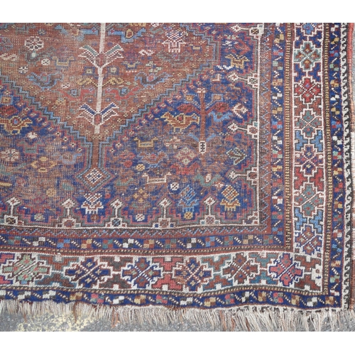 748 - A Persian rug on blue and white ground with 2 centre medallions (badly worn), 162cm X 1 meter 21cm.