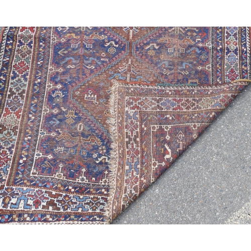 748 - A Persian rug on blue and white ground with 2 centre medallions (badly worn), 162cm X 1 meter 21cm.