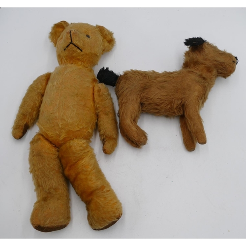 758 - A child's soft toy dog, 31cm long and an English Teddy Bear, 46.5cm high (both worn). (2)