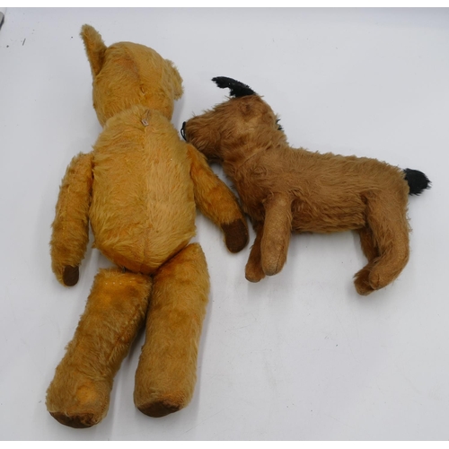 758 - A child's soft toy dog, 31cm long and an English Teddy Bear, 46.5cm high (both worn). (2)