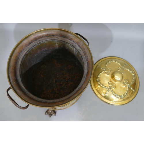 775 - A brass and wrought iron round 2-handled coal bucket with cover, embossed ribbon and swag decoration... 