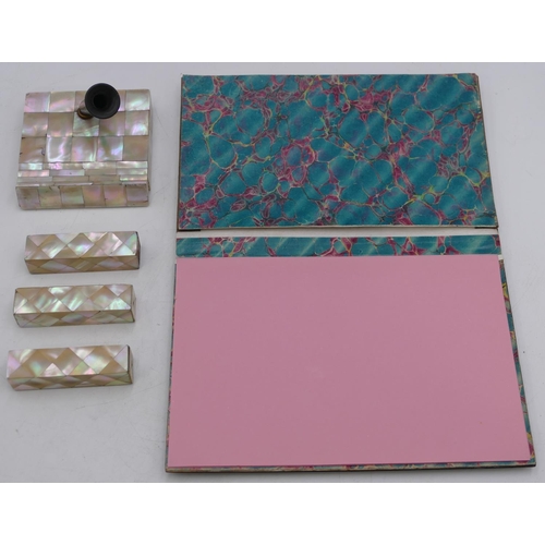 787 - A Mother of Pearl and papier mache rectangular shaped desk blotter with hinged front, 23cm wide, a s... 