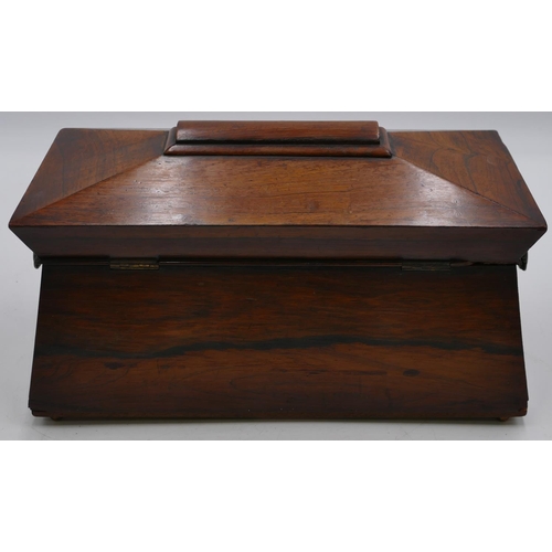 798 - A 19th Century rosewood sarcophagus shaped tea caddy with hinged lid enclosing 2 bone lidded tea cad... 