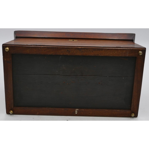 798 - A 19th Century rosewood sarcophagus shaped tea caddy with hinged lid enclosing 2 bone lidded tea cad... 