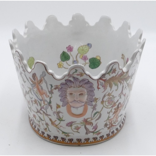 8 - A reproduction oval jardiniere with crinkled rim on white ground and multi-coloured cupid. floral an... 