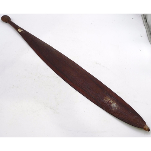 802 - An Australian Aboriginal Woomera spear thrower, attached with hook with allover carved decoration to... 