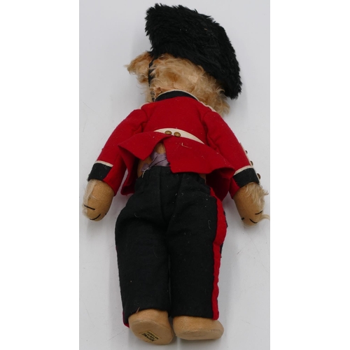 803 - A rare Merrythought Bingie guardsman teddy bear with blonde mohair head and hands, orange and black ... 