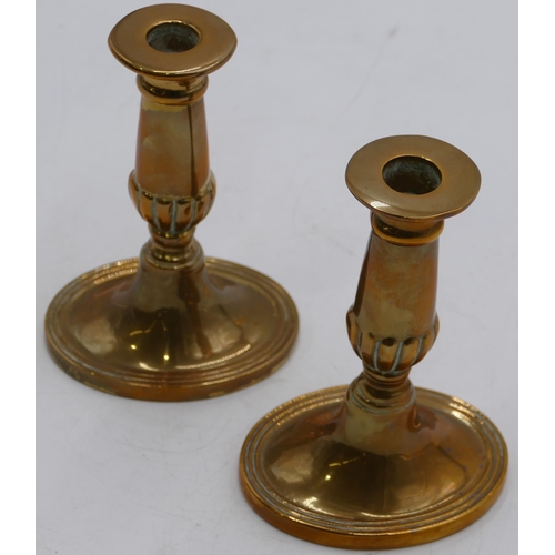 806 - A pair of brass candlesticks on turn stems with oval sweeping bases, 15.5cm high