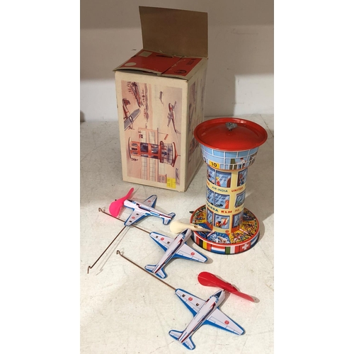 823 - A West German Keine Kinderspielzeug tin plate mechanical airport tower with 3 planes, boxed