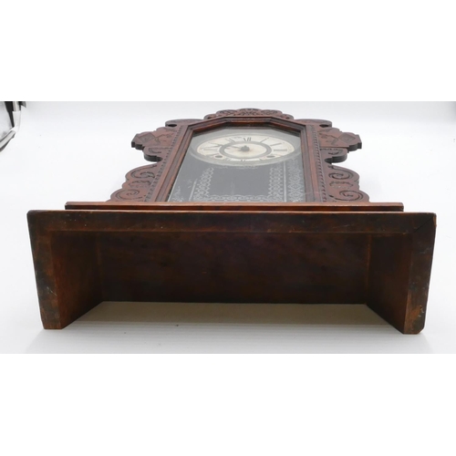 834 - An American Ansonia mantle clock with allover carved decoration, glass door enclosing cream dial wit... 