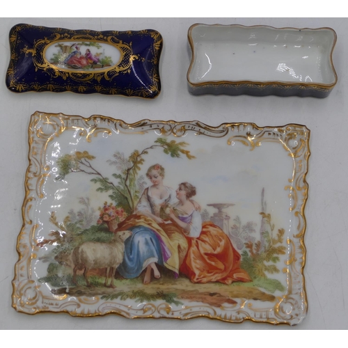 84 - A Continental porcelain small rectangular scallop shaped tray with painted figures of 2 ladies and s... 