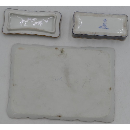 84 - A Continental porcelain small rectangular scallop shaped tray with painted figures of 2 ladies and s... 