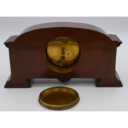 840 - An Edwardian mahogany mantel clock with carved leaf and scroll decoration, silvered dial with Roman ... 