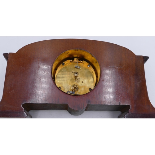 840 - An Edwardian mahogany mantel clock with carved leaf and scroll decoration, silvered dial with Roman ... 