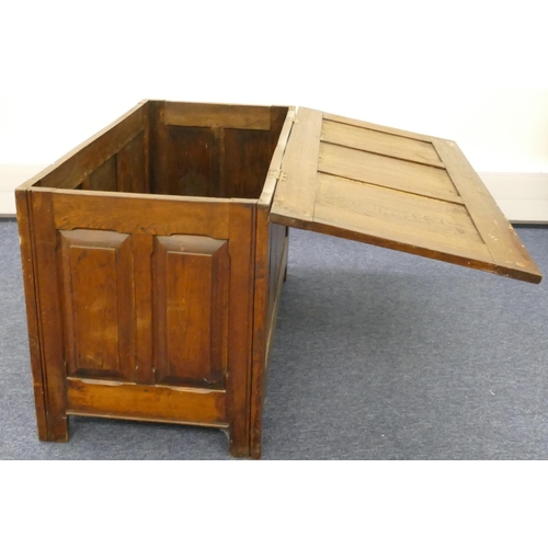 856 - An early 20th Century dower chest with triple panelled hinged top, carved triple panelled front and ... 