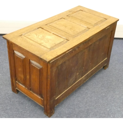 856 - An early 20th Century dower chest with triple panelled hinged top, carved triple panelled front and ... 