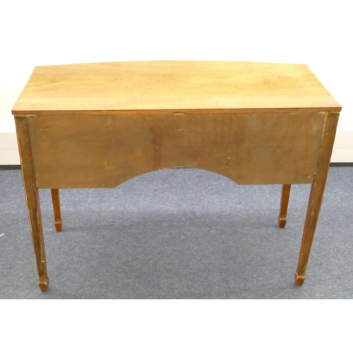 859 - A 19th Century mahogany bow fronted side table with centre drawer above knee hole, flanked by 2 deep... 