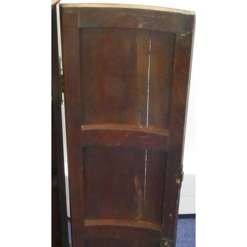 861 - A George III mahogany hanging bow fronted corner cupboard with 2 panel doors, enclosing shelves, 65.... 